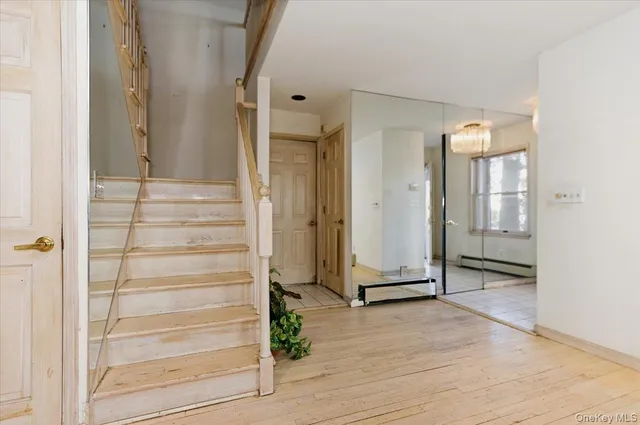 a view of a entryway door with wooden floor