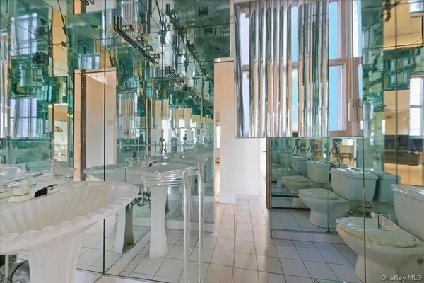 a utility room with cabinets washer and dryer