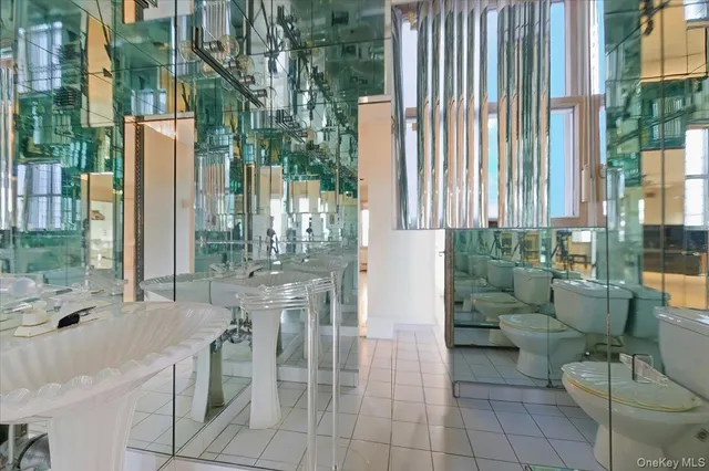 a utility room with cabinets washer and dryer