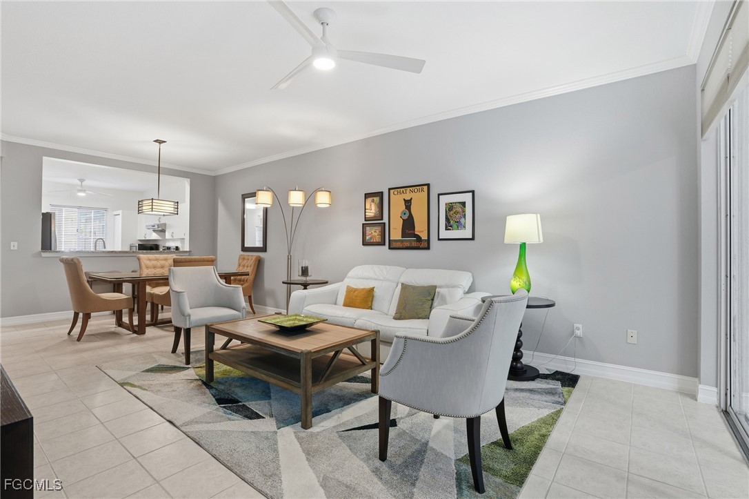 770 Luisa Lane, Unit 3 Naples, FL 34104 - Photo 11 of 38 a living room with furniture and a wooden floor