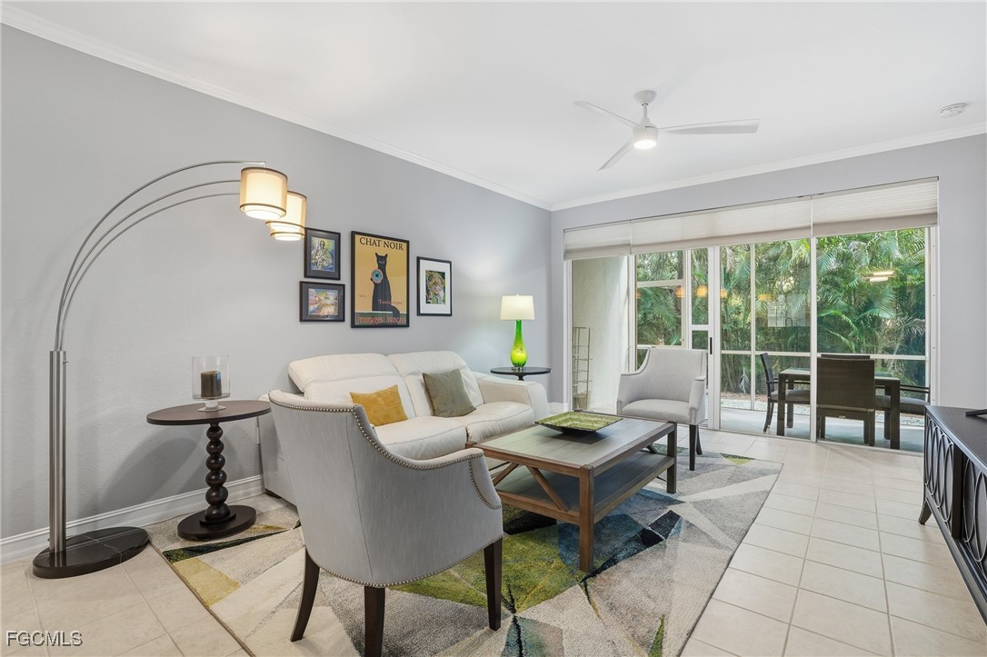 770 Luisa Lane, Unit 3 Naples, FL 34104 - Photo 13 of 38 a living room with furniture and floor to ceiling window