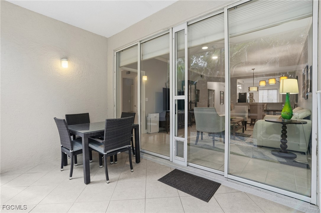 770 Luisa Lane, Unit 3 Naples, FL 34104 - Photo 15 of 38 a view of a dining room with furniture