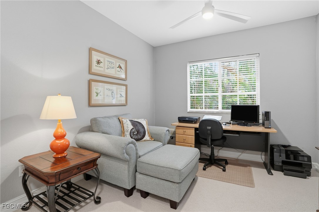 770 Luisa Lane, Unit 3 Naples, FL 34104 - Photo 24 of 38 a living room with furniture and a window