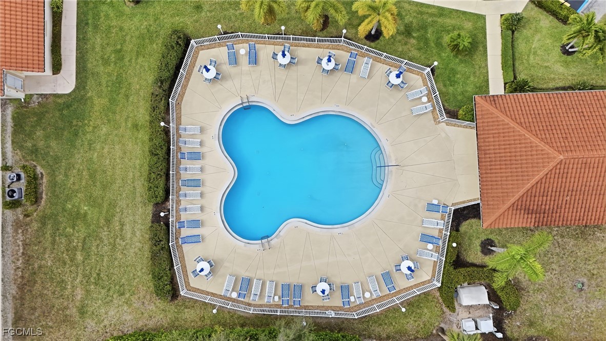 770 Luisa Lane, Unit 3 Naples, FL 34104 - Photo 28 of 38 a view of a wooden floor with a swimming pool