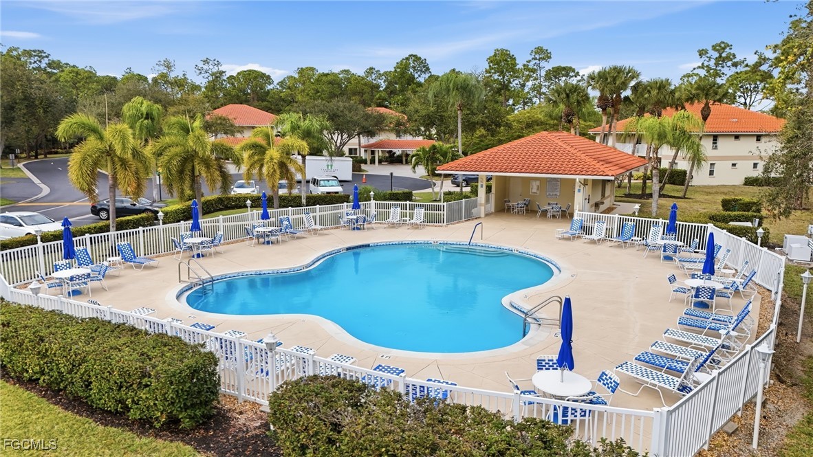 770 Luisa Lane, Unit 3 Naples, FL 34104 - Photo 29 of 38 swimming pool view with a seating space