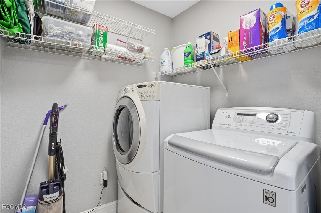 770 Luisa Lane, Unit 3 Naples, FL 34104 - Photo 34 of 38 a utility room with dryer and washer