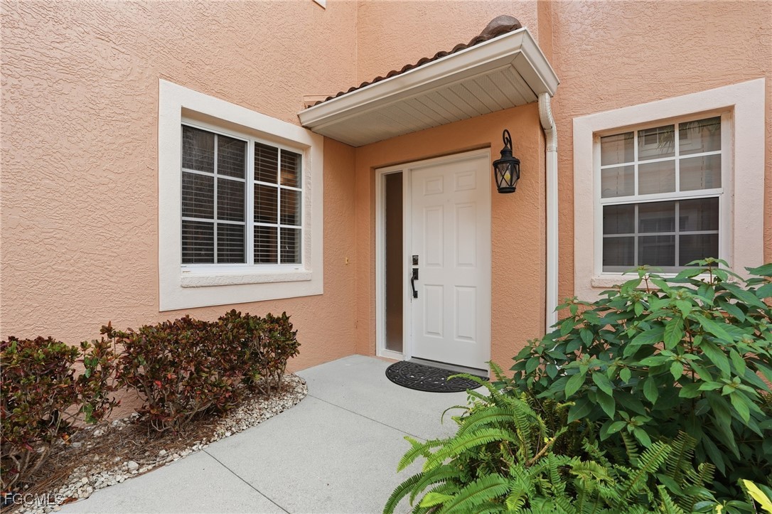 770 Luisa Lane, Unit 3 Naples, FL 34104 - Photo 35 of 38 a front view of a house