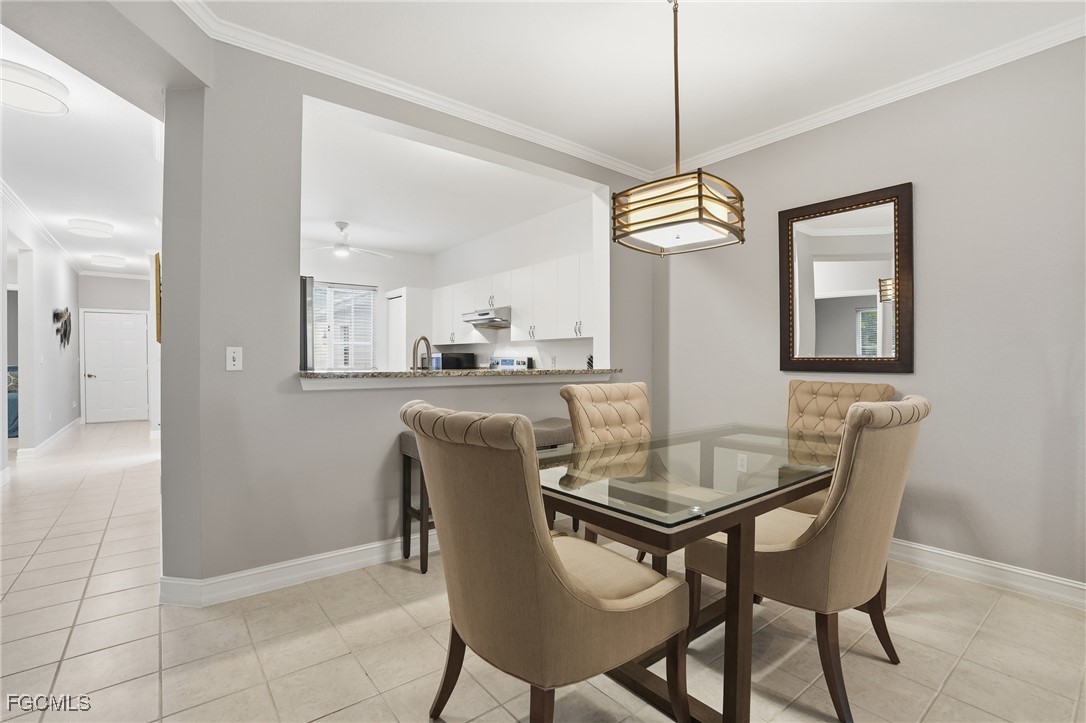 770 Luisa Lane, Unit 3 Naples, FL 34104 - Photo 9 of 38 a dining room with furniture and window