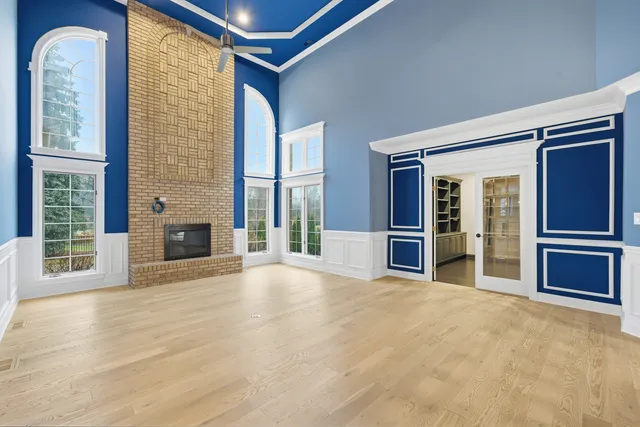 a view of a hallway with closet and wooden floor