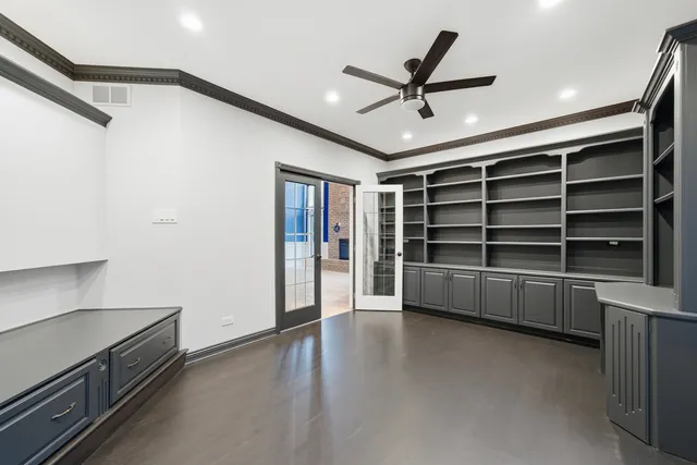 a bathroom with a granite countertop sink a toilet and shower