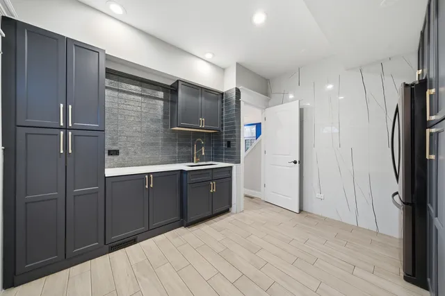 a bathroom with a double vanity sink mirror and shower