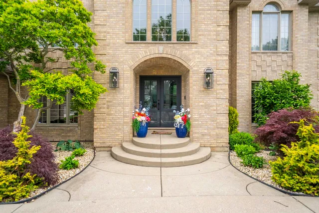 a view of entryway and hall with a front door