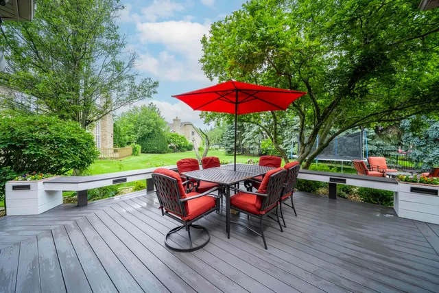 a large white kitchen with a large window
