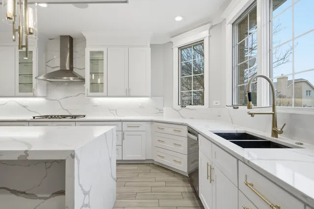 a view of an empty room with a fireplace and a window
