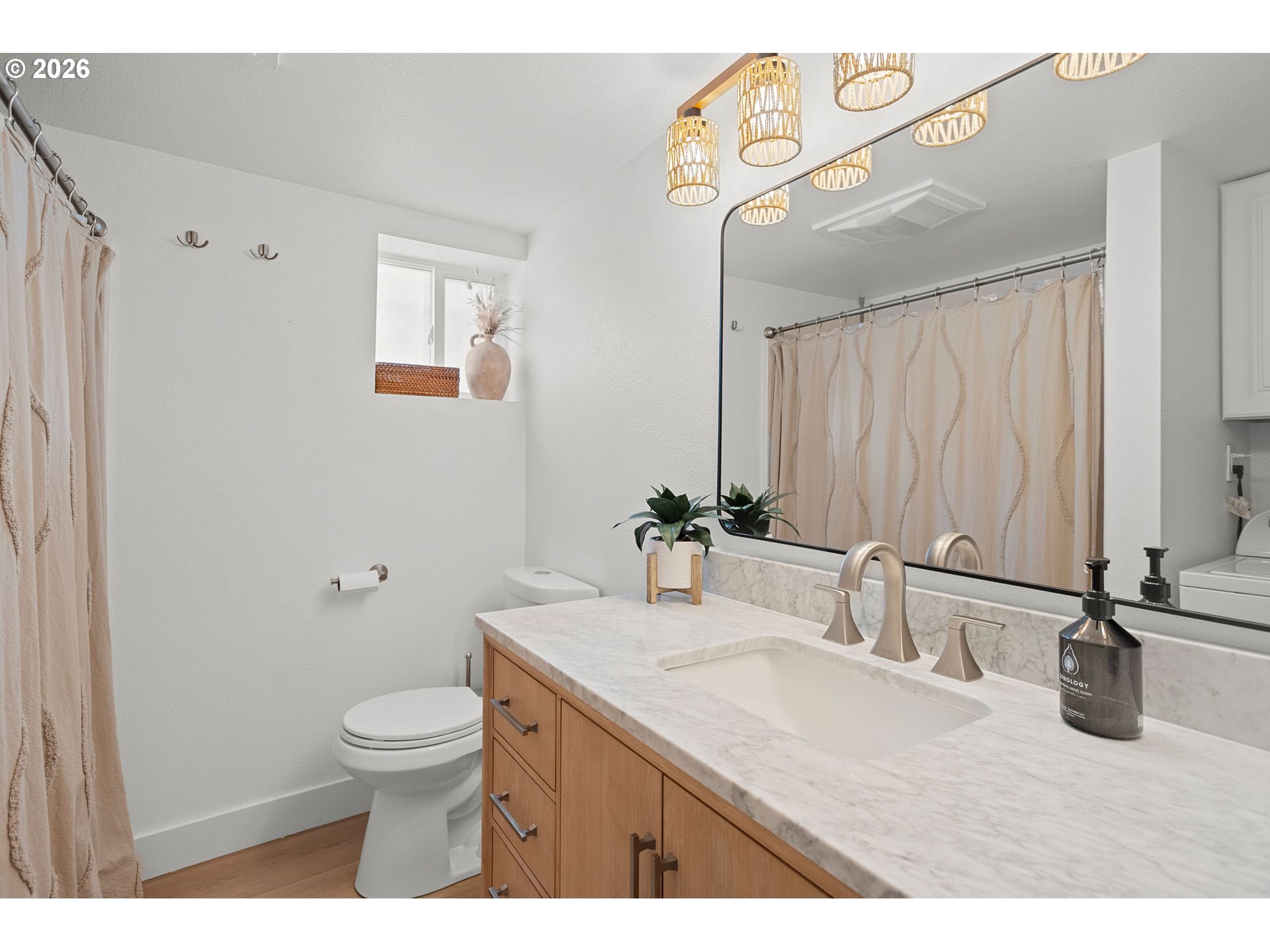 2102 Kelly Road, Unit 9 Vancouver, WA 98665 - Photo 22 of 29 a bathroom with a granite countertop sink a toilet and a mirror
