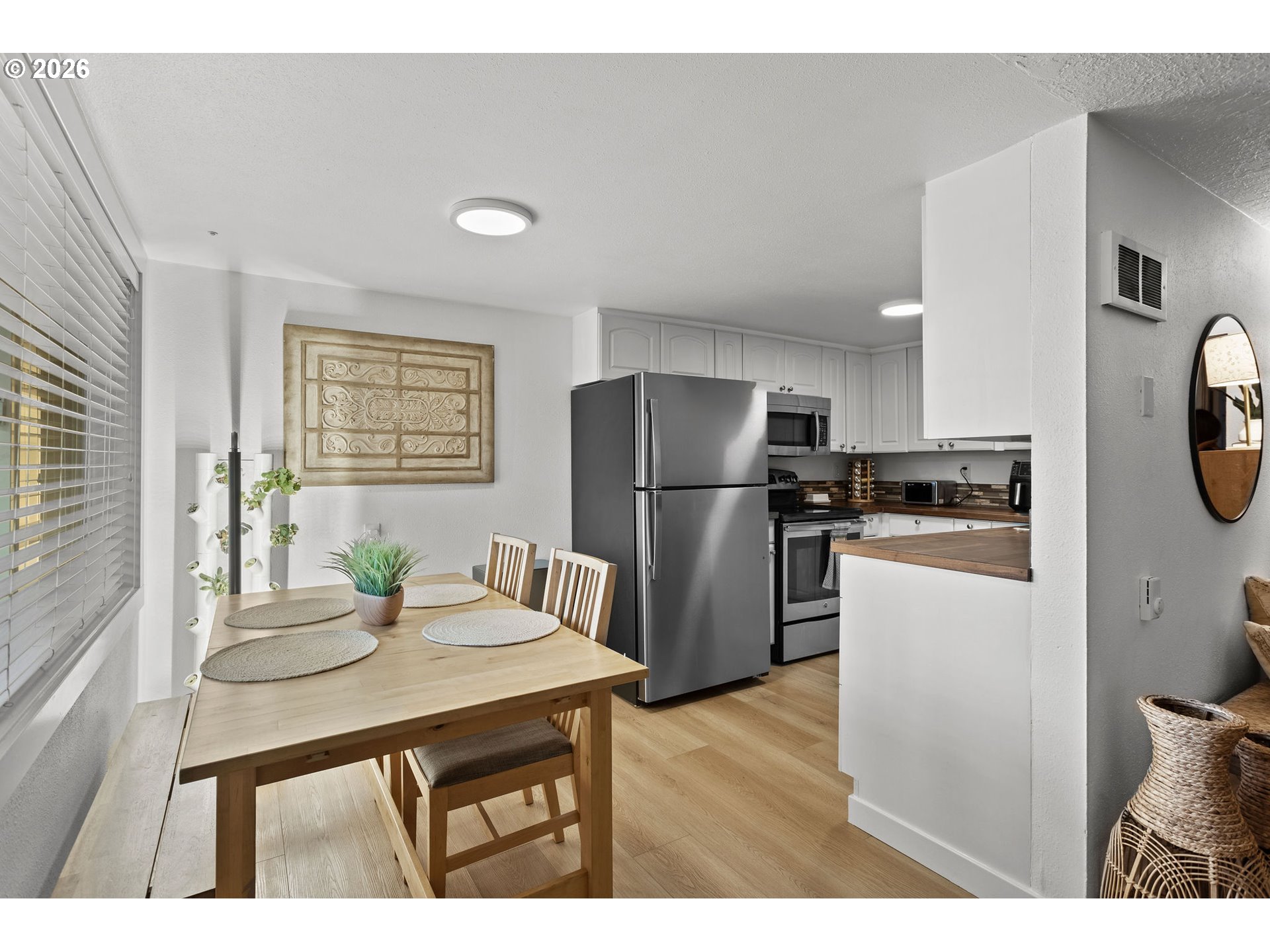 2102 Kelly Road, Unit 9 Vancouver, WA 98665 - Photo 5 of 29 a kitchen with refrigerator and wooden floor