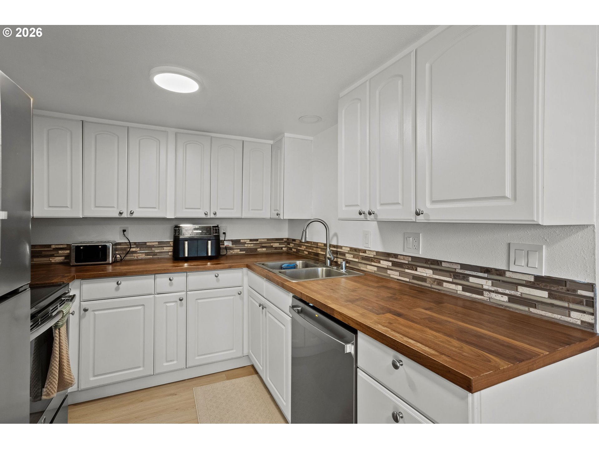 2102 Kelly Road, Unit 9 Vancouver, WA 98665 - Photo 10 of 29 a kitchen with sink cabinets and window