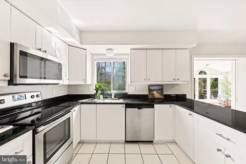 a view of a storage & utility room with a washer dryer