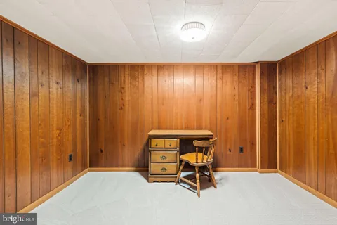 a view of balcony with wooden deck and trees
