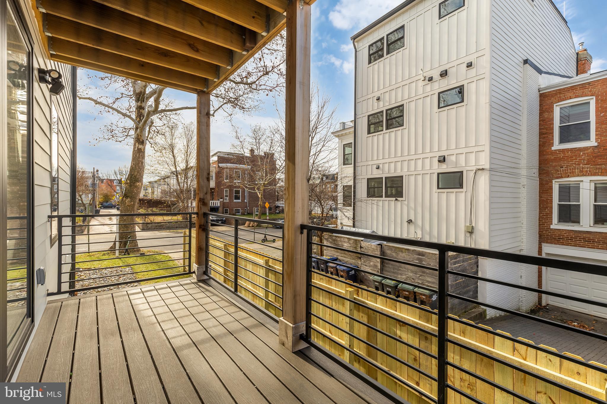 641 Quebec Place Northwest, Unit 1 Washington, DC 20010 - Photo 12 of 30 a view of a balcony with wooden floor and iron stairs