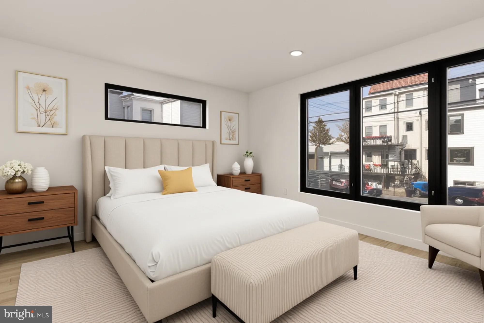 641 Quebec Place Northwest, Unit 1 Washington, DC 20010 - Photo 16 of 30 a bedroom with a bed couch and a large window