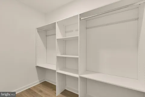 a view of an empty walk in closet