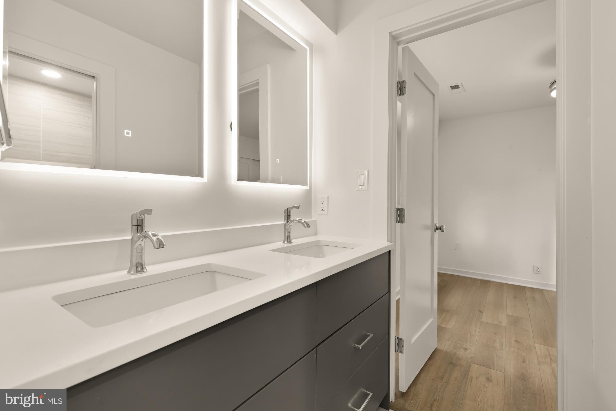 641 Quebec Place Northwest, Unit 1 Washington, DC 20010 - Photo 26 of 30 a bathroom with a sink and a mirror