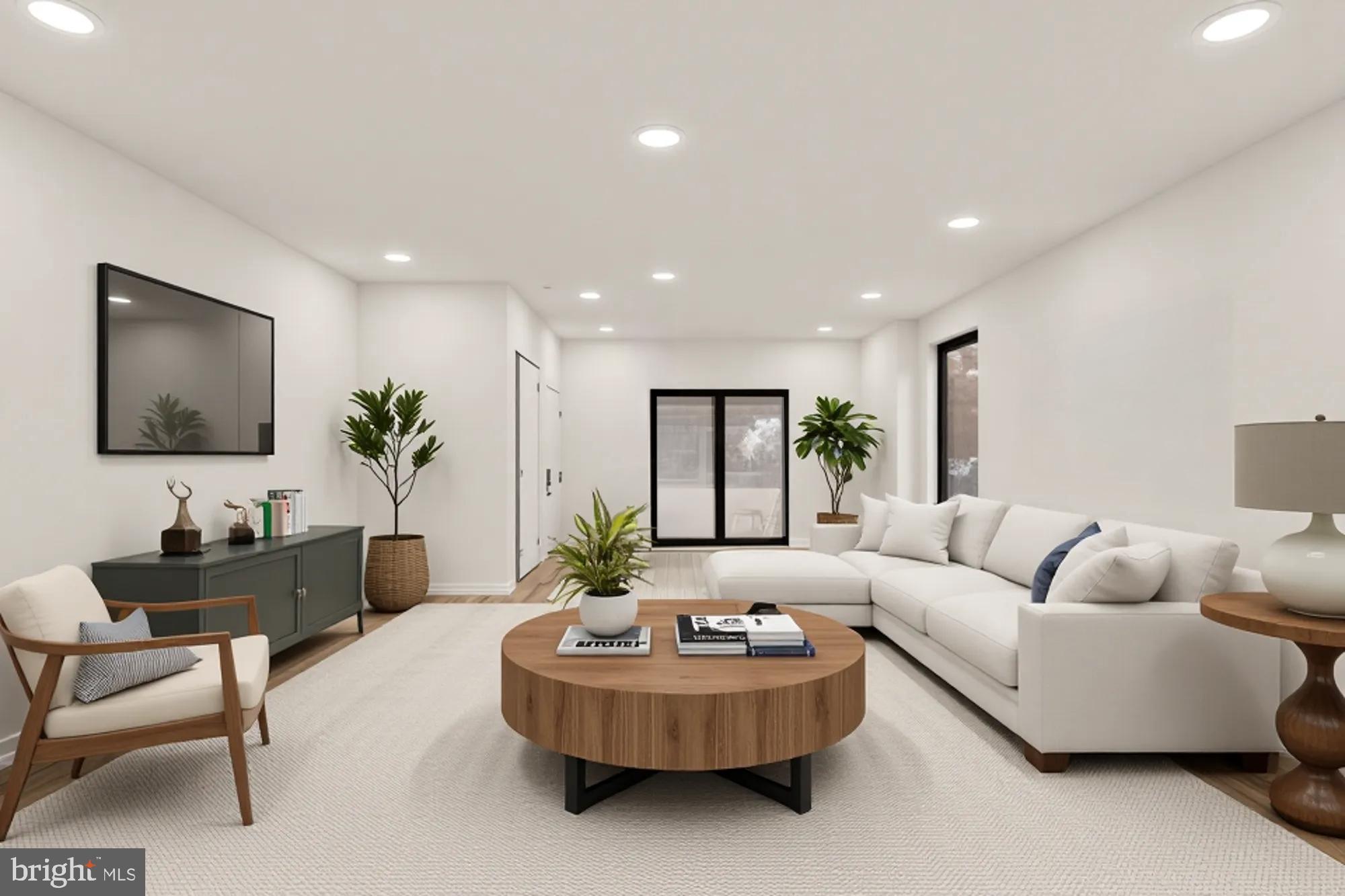 641 Quebec Place Northwest, Unit 1 Washington, DC 20010 - Photo 5 of 30 a living room with furniture and a potted plant