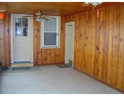 60 Corona Street Springfield, MA 01104 - Photo 4 of 6 an empty room with wooden floor and windows