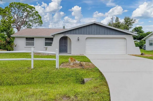 a house with swimming pool in front of it