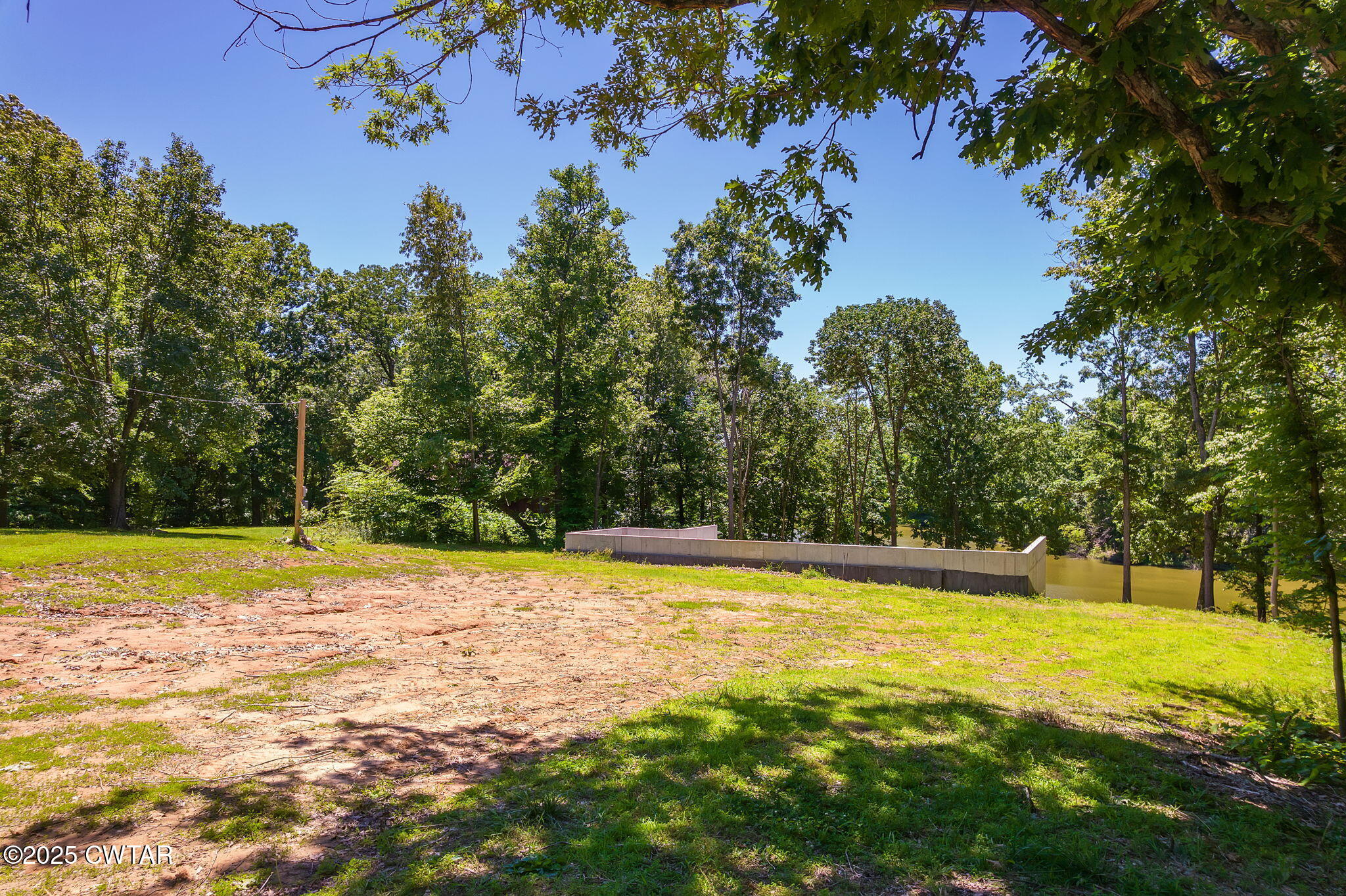 64 Lake Hayes Estates Road Trenton, TN 38382 - Photo 12 of 25 a view of a swimming pool with an outdoor space and seating area