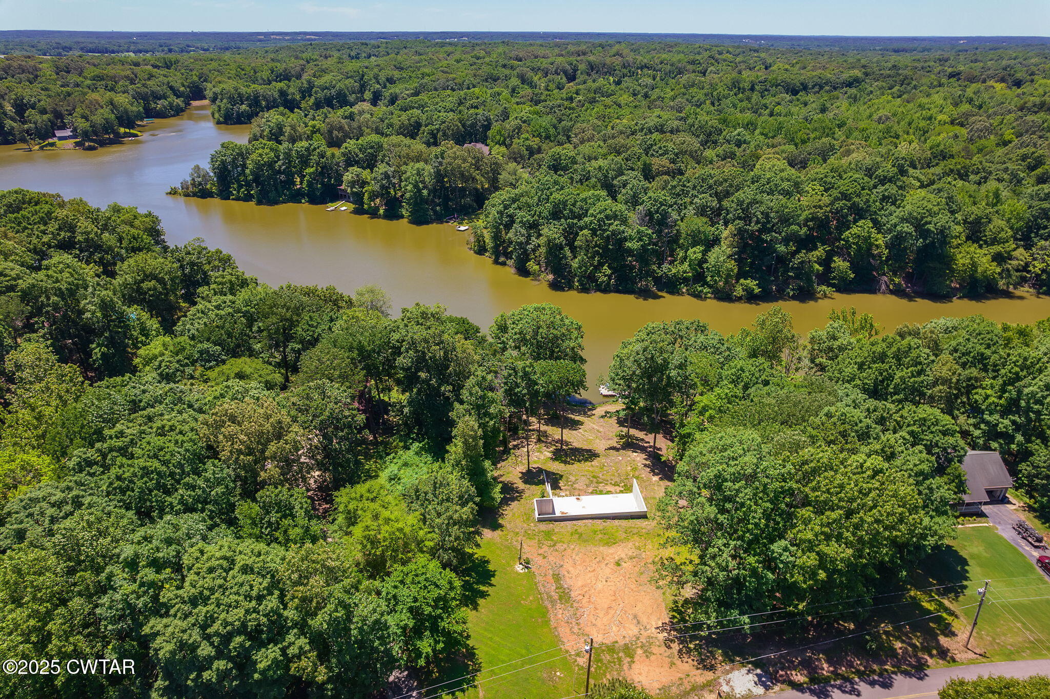 64 Lake Hayes Estates Road Trenton, TN 38382 - Photo 14 of 25 an aerial view of residential houses with outdoor space and lake view