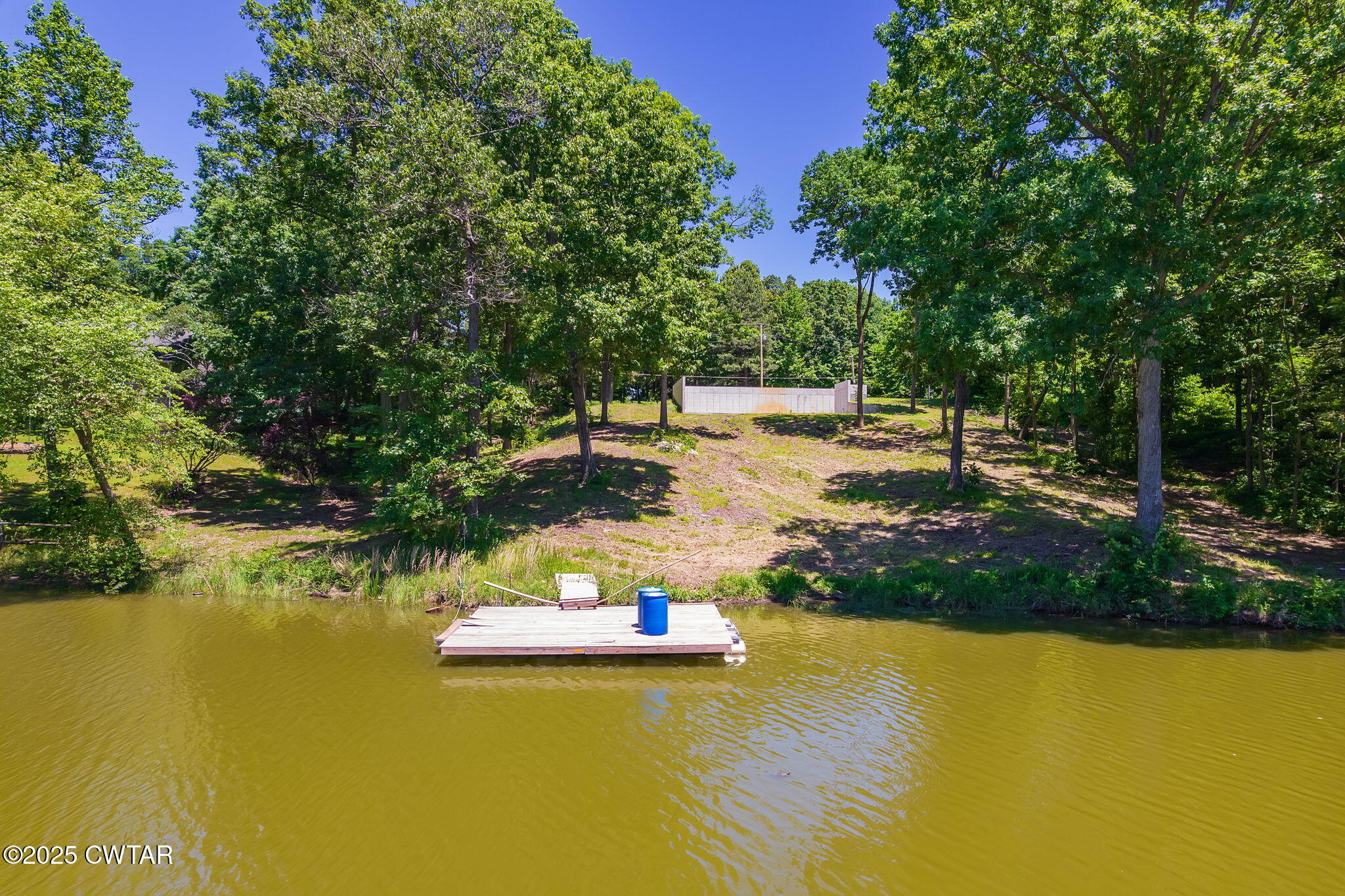 64 Lake Hayes Estates Road Trenton, TN 38382 - Photo 2 of 25 a view of a lake with a yard