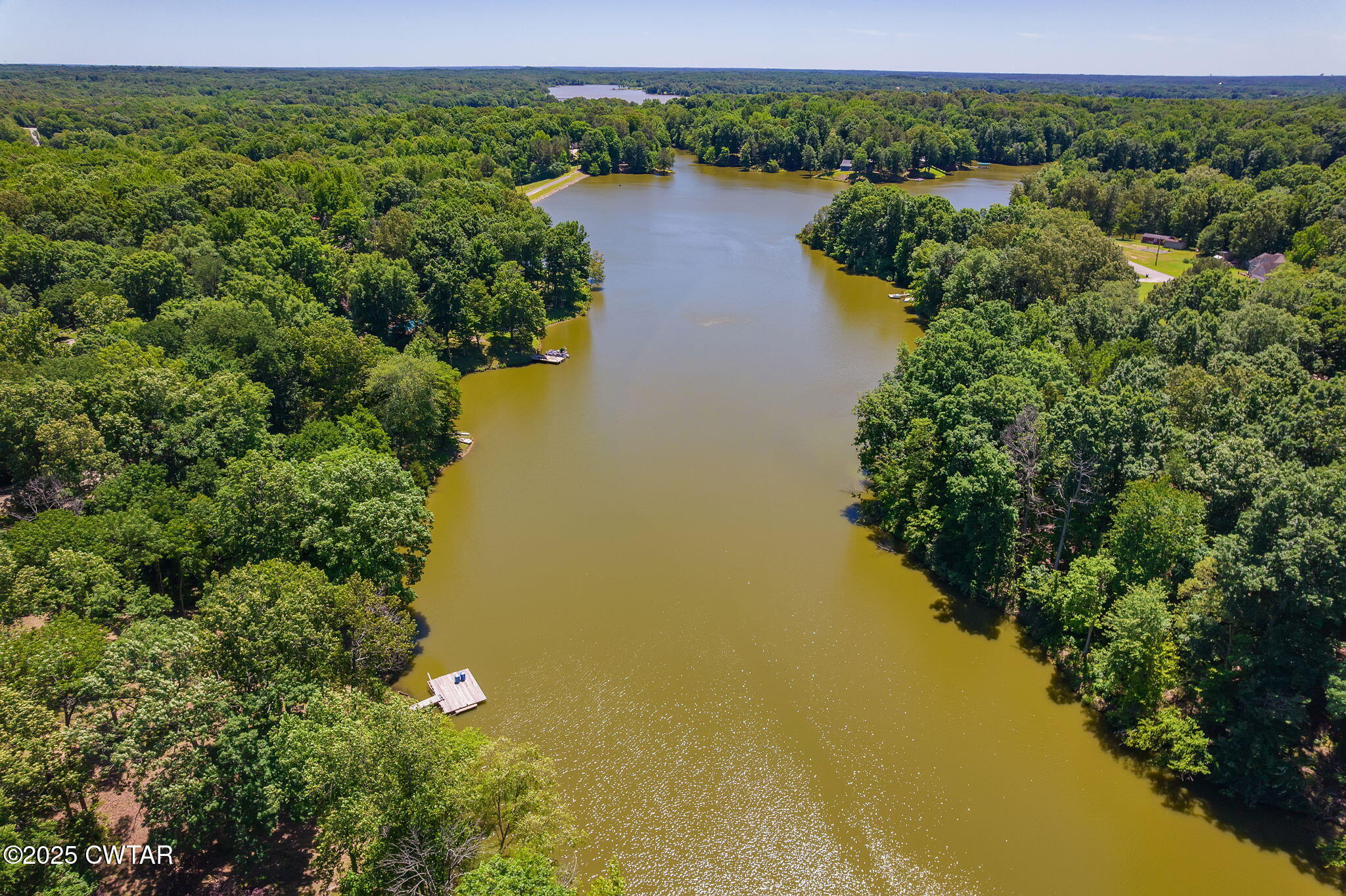 64 Lake Hayes Estates Road Trenton, TN 38382 - Photo 22 of 25 a view of a lake with a city
