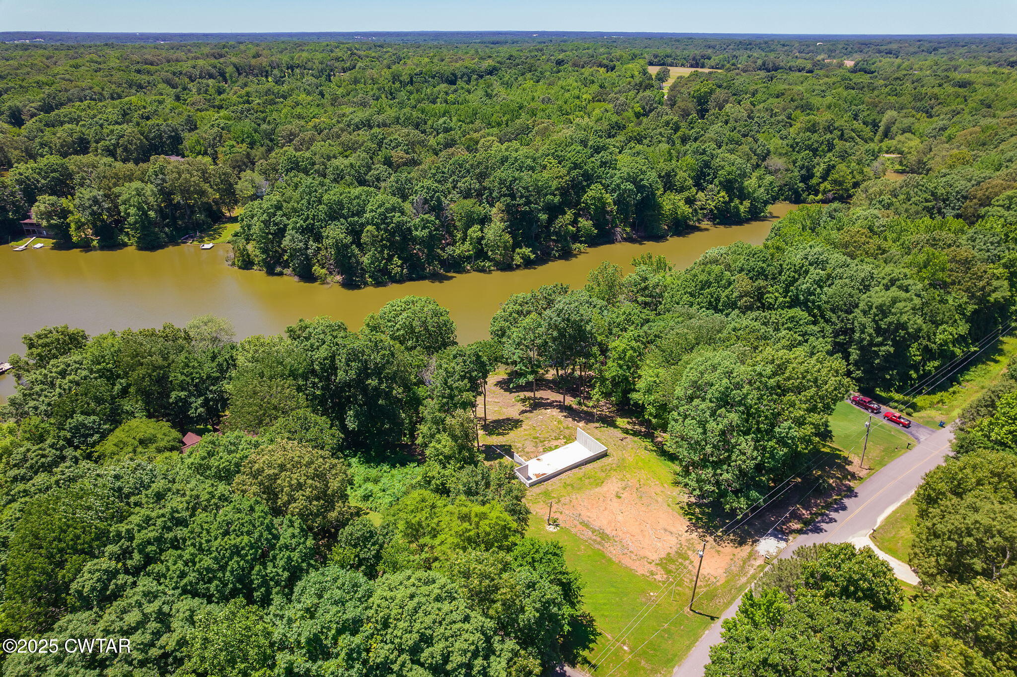 64 Lake Hayes Estates Road Trenton, TN 38382 - Photo 3 of 25 an aerial view of residential house with outdoor space and trees all around