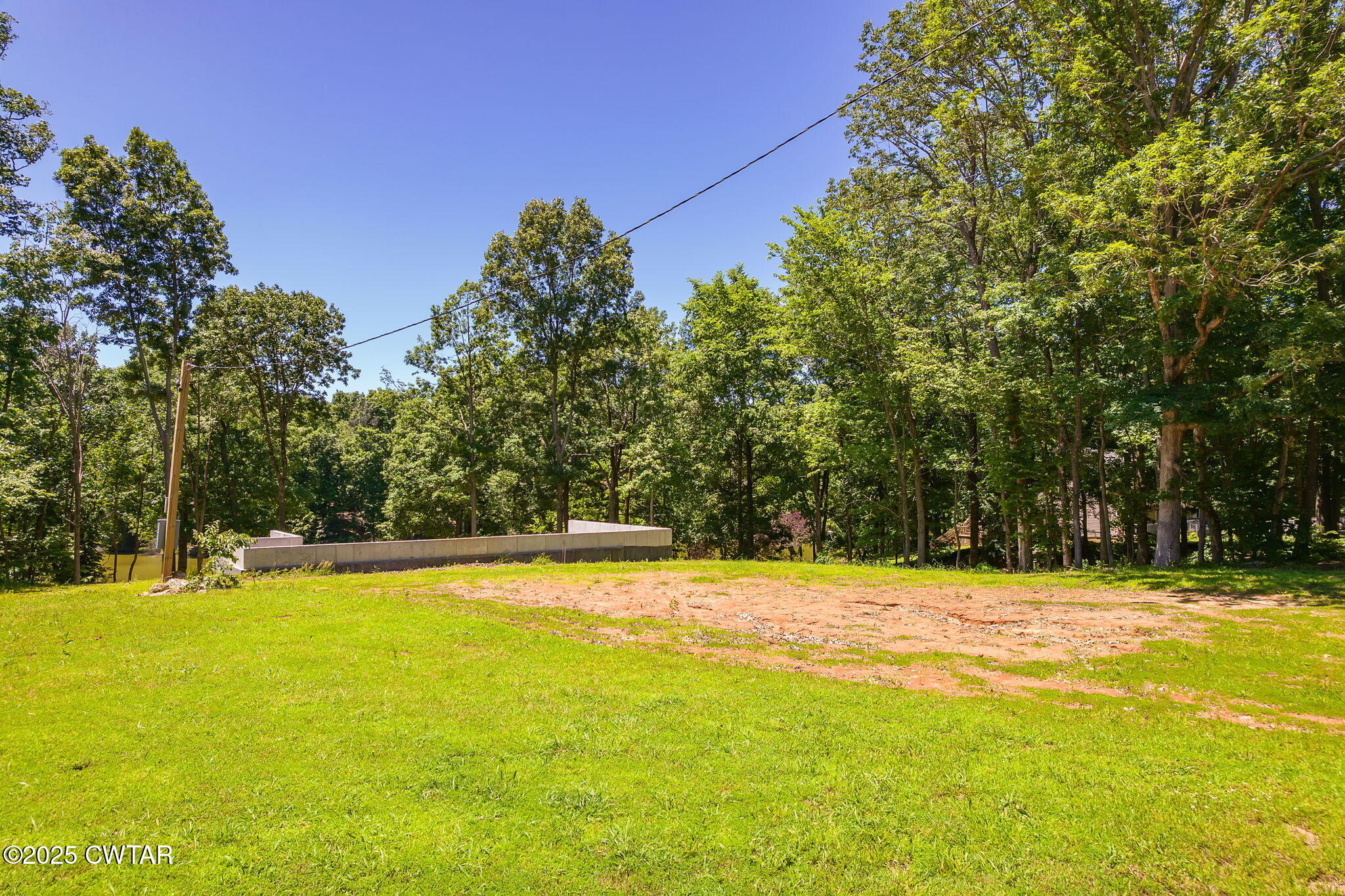 64 Lake Hayes Estates Road Trenton, TN 38382 - Photo 5 of 25 a view of a swimming pool with an outdoor space and seating area