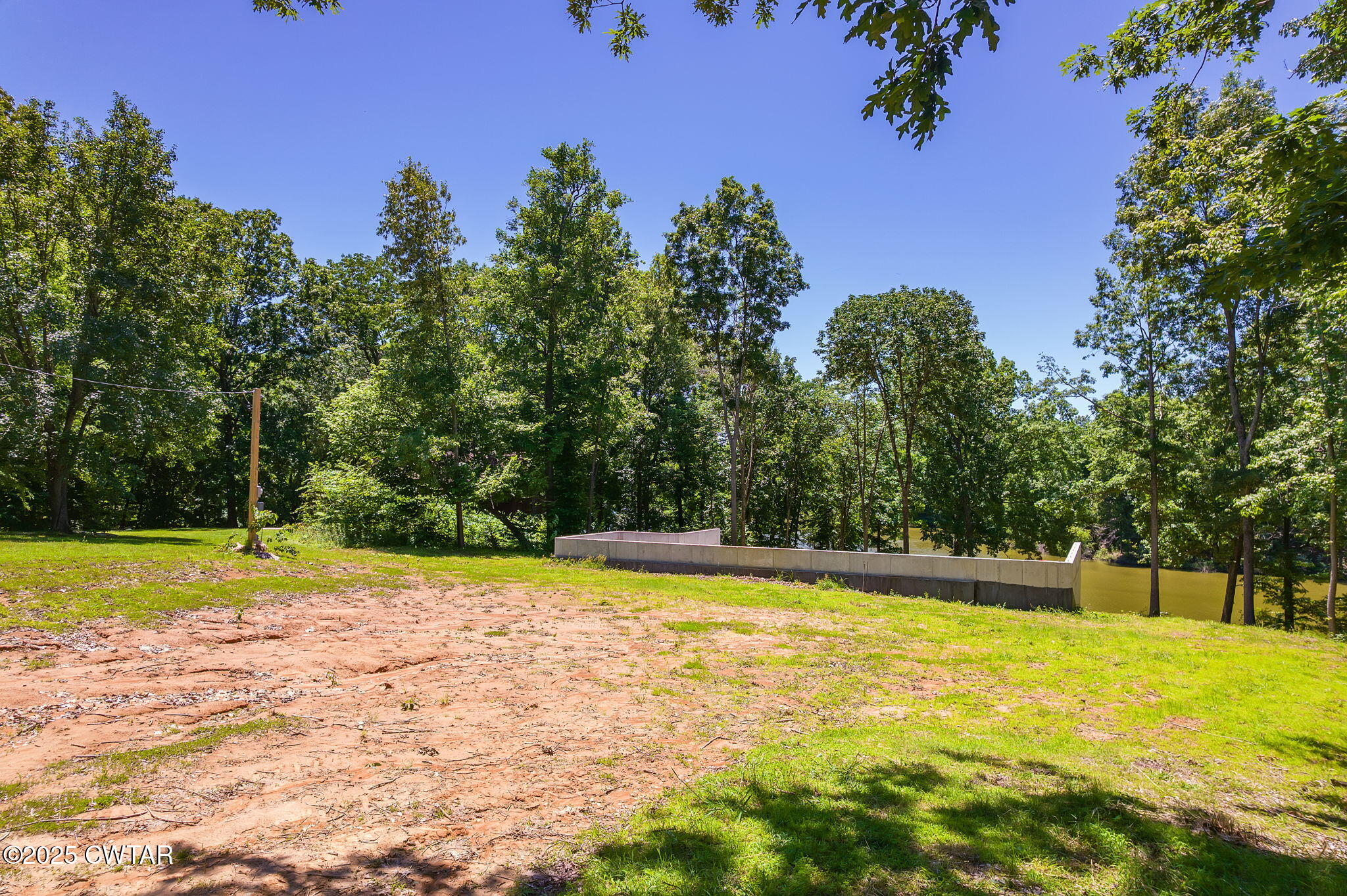 64 Lake Hayes Estates Road Trenton, TN 38382 - Photo 6 of 25 a view of a swimming pool with a yard