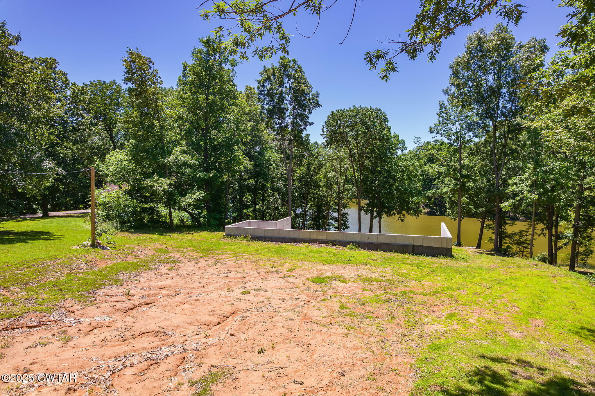 64 Lake Hayes Estates Road Trenton, TN 38382 - Photo 8 of 25 a view of a swimming pool with an outdoor space and seating area