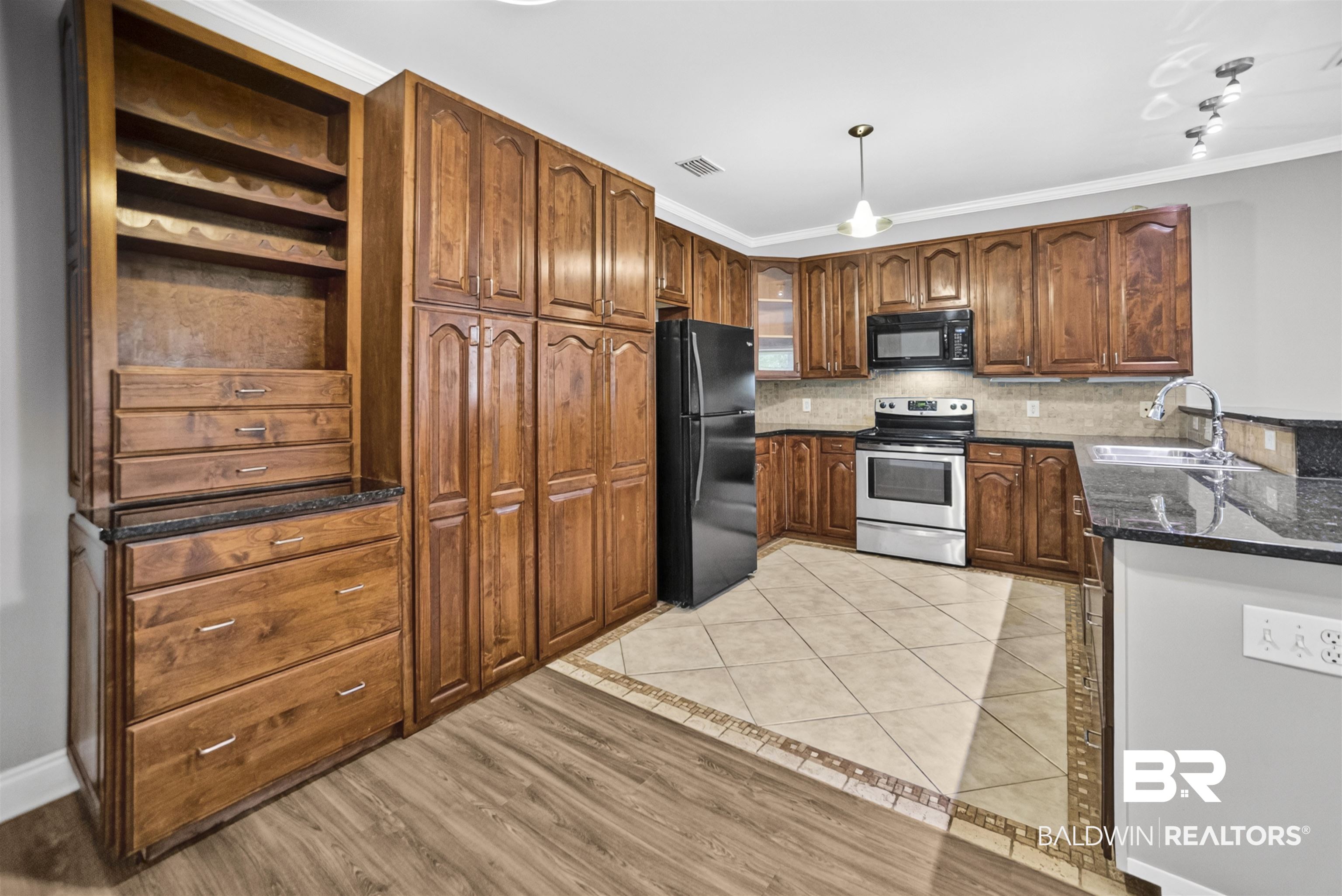 5913 Antoine Road Mobile, AL 36693 - Photo 10 of 33 Kitchen featuring wood cabinetry, dark countertops, a stainless steel range, and a black refrigerator
