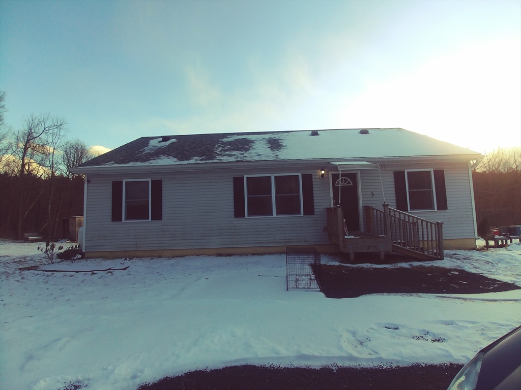a front view of house with yard