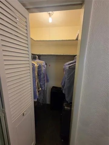 a view of storage and utility room with washer and dryer