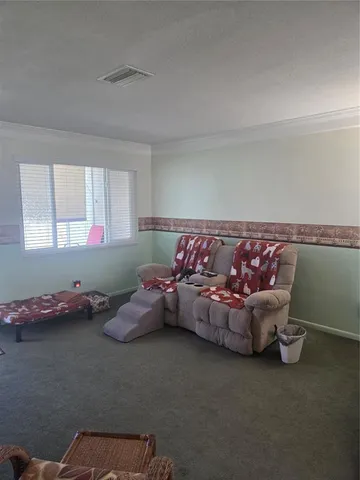 a living room with furniture and window