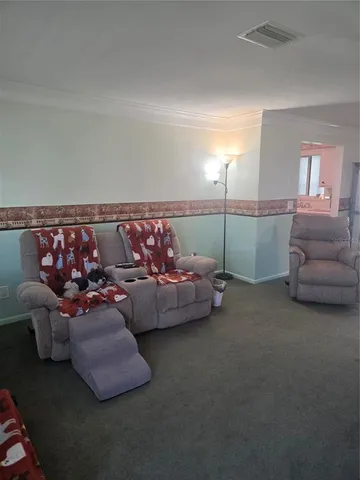 a living room with furniture and a couch