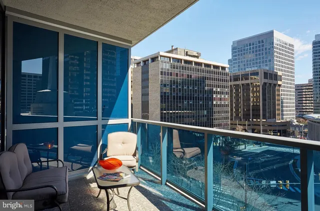 a balcony view with a seating space