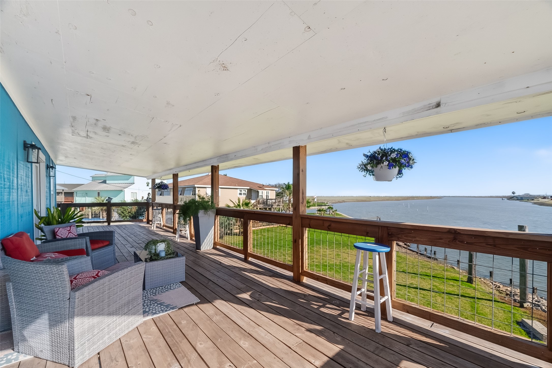 a view of a living room and a balcony