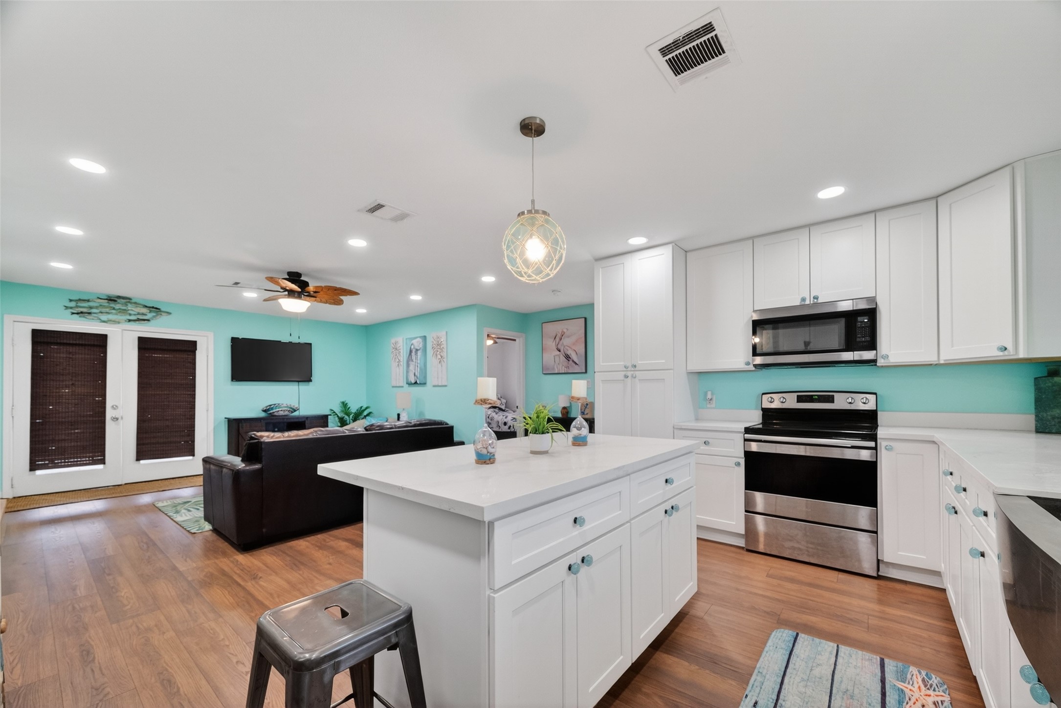 154 Poop Deck Lane Freeport, TX 77541 - Photo 9 of 32 a kitchen with a sink stove and cabinets