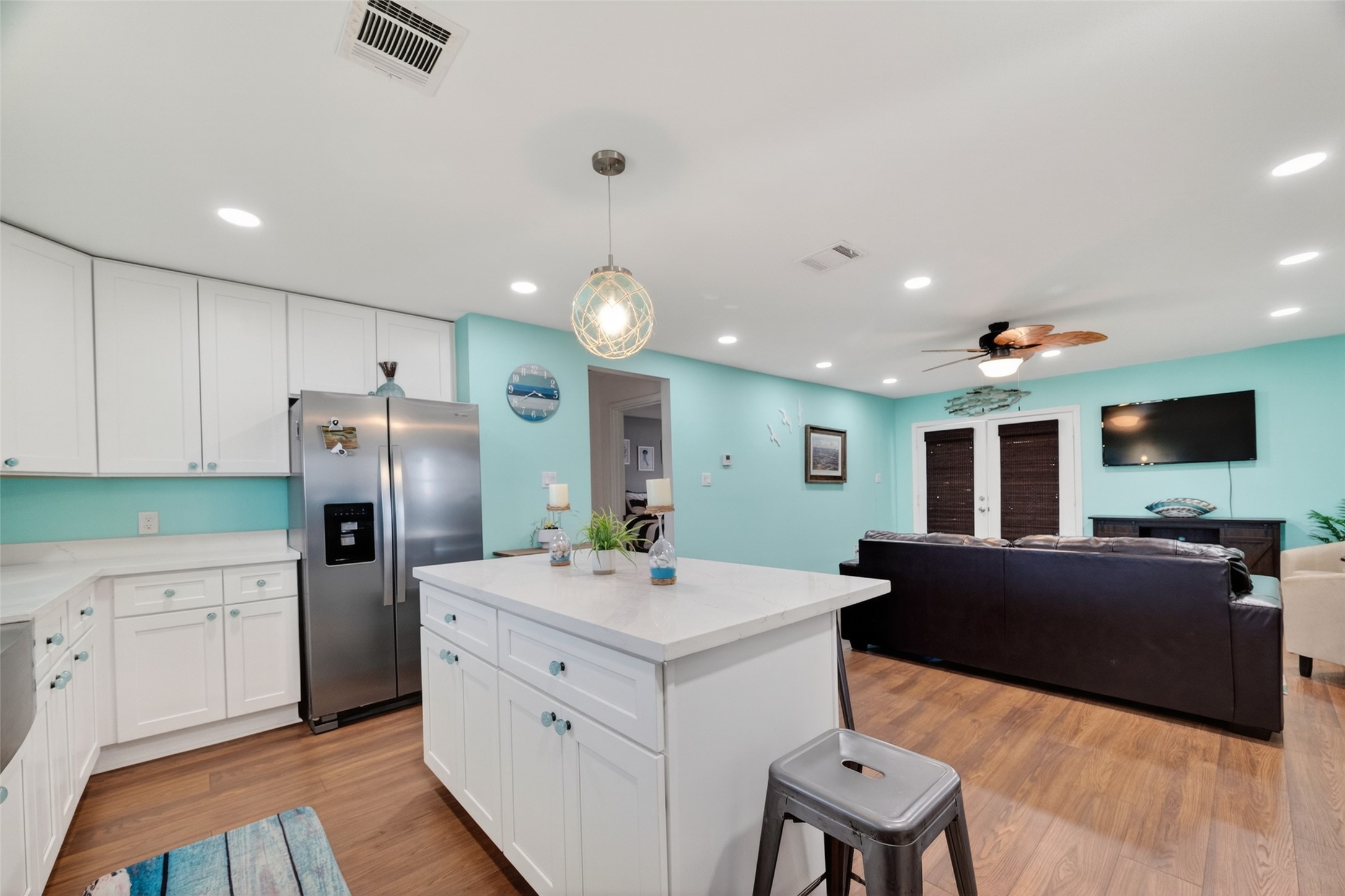 154 Poop Deck Lane Freeport, TX 77541 - Photo 10 of 32 a kitchen with stainless steel appliances kitchen island granite countertop a refrigerator and a stove top oven