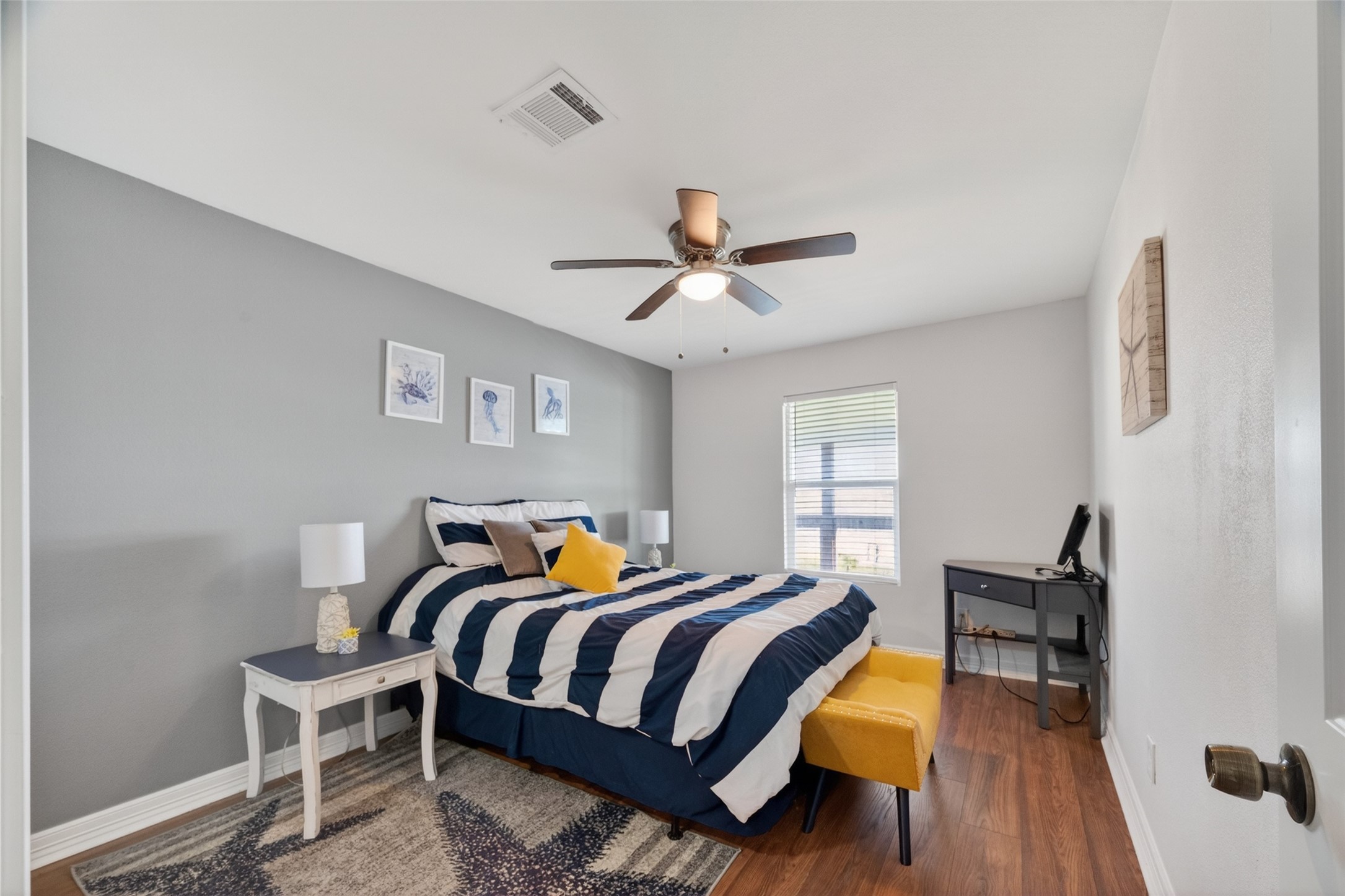 154 Poop Deck Lane Freeport, TX 77541 - Photo 12 of 32 a bedroom with a bed and wooden floor