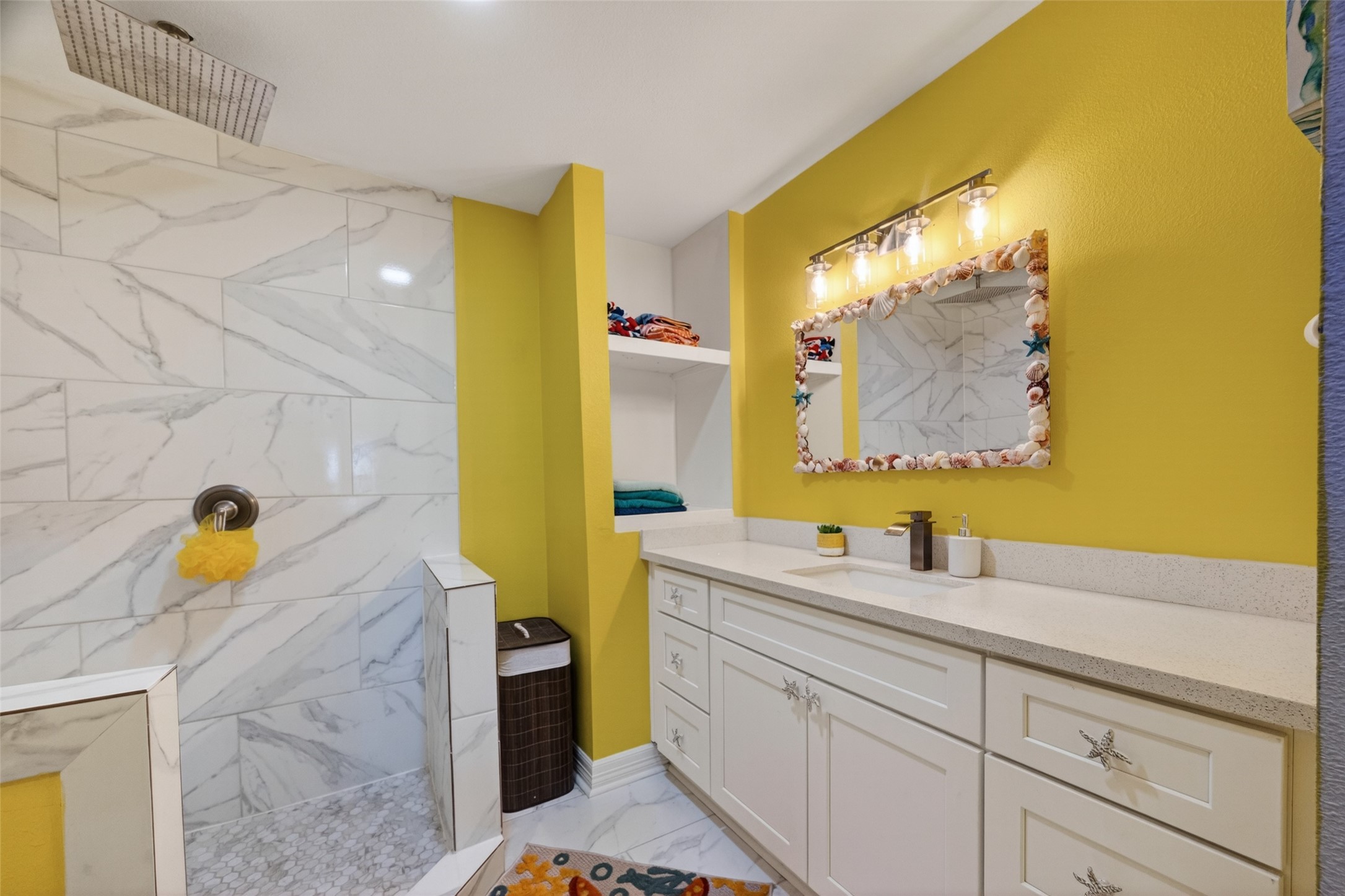 154 Poop Deck Lane Freeport, TX 77541 - Photo 15 of 32 a bathroom with a sink and a mirror