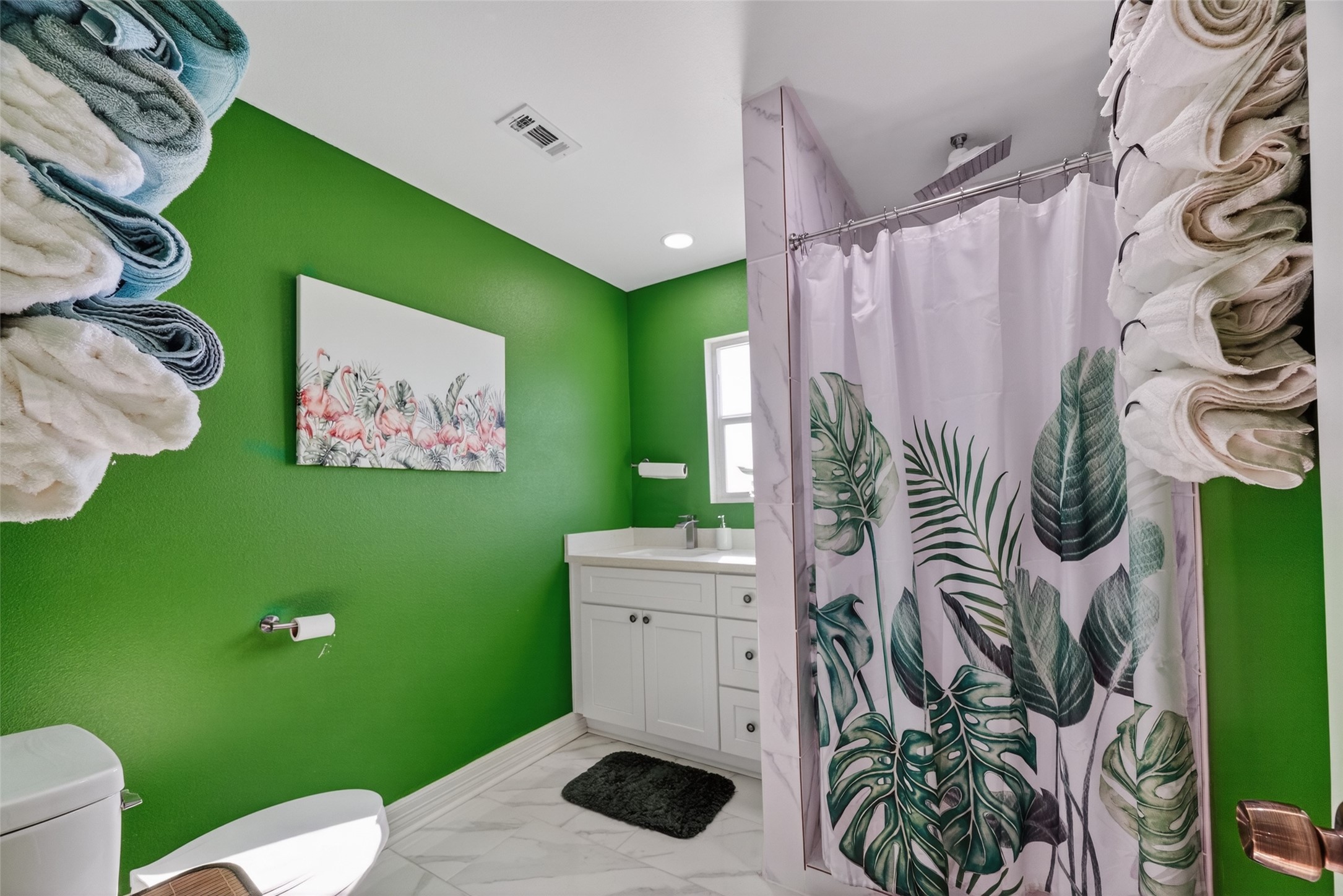 154 Poop Deck Lane Freeport, TX 77541 - Photo 18 of 32 a bathroom with a toilet sink and mirror